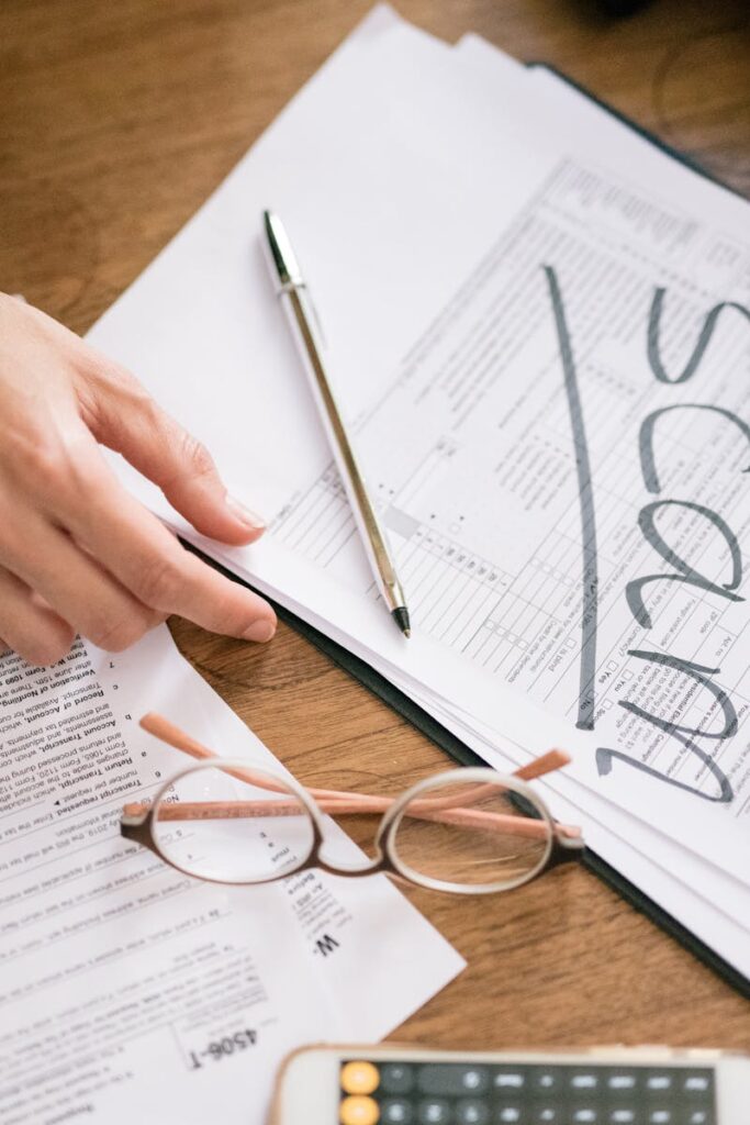 A close look at tax forms marked with scam, highlighting financial fraud risks.